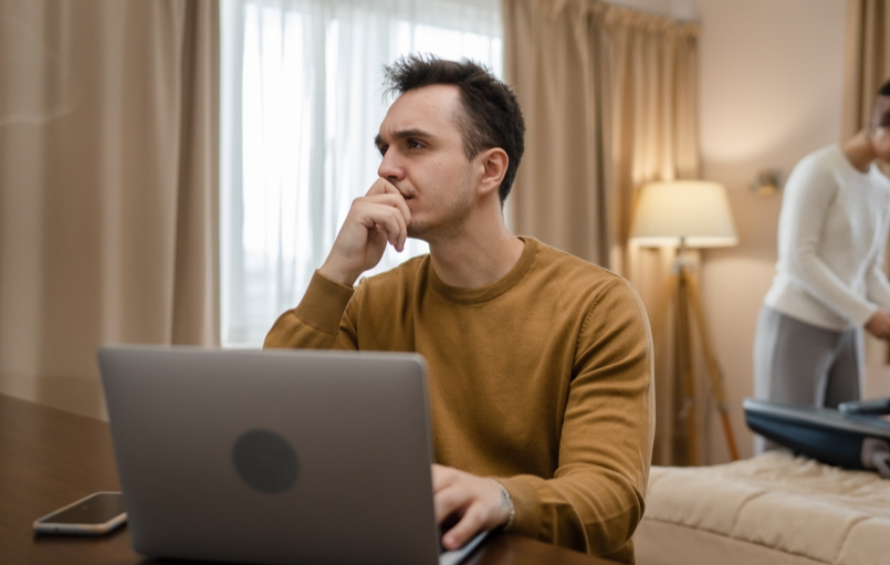 couple unpacking at a hotel room