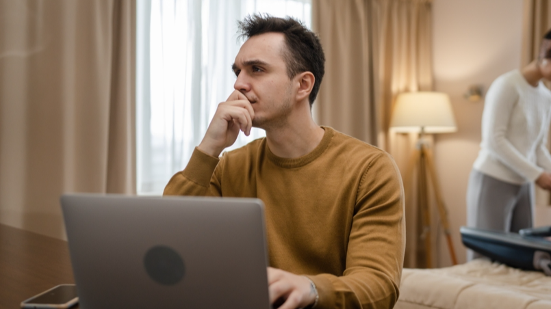couple unpacking at a hotel room