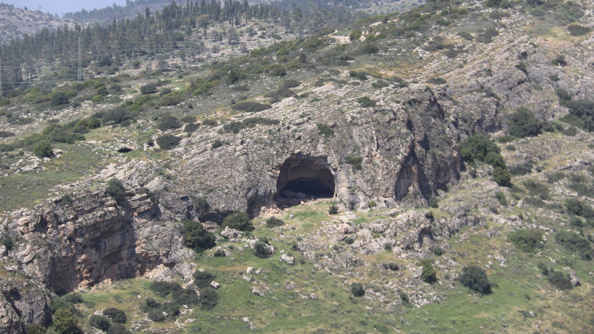 a mountain with a cave in the middle of it