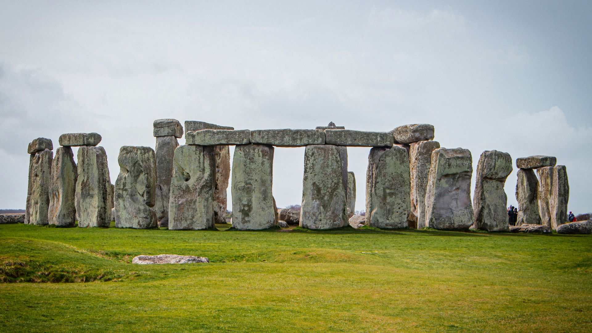 a large stone structure in the middle of a field