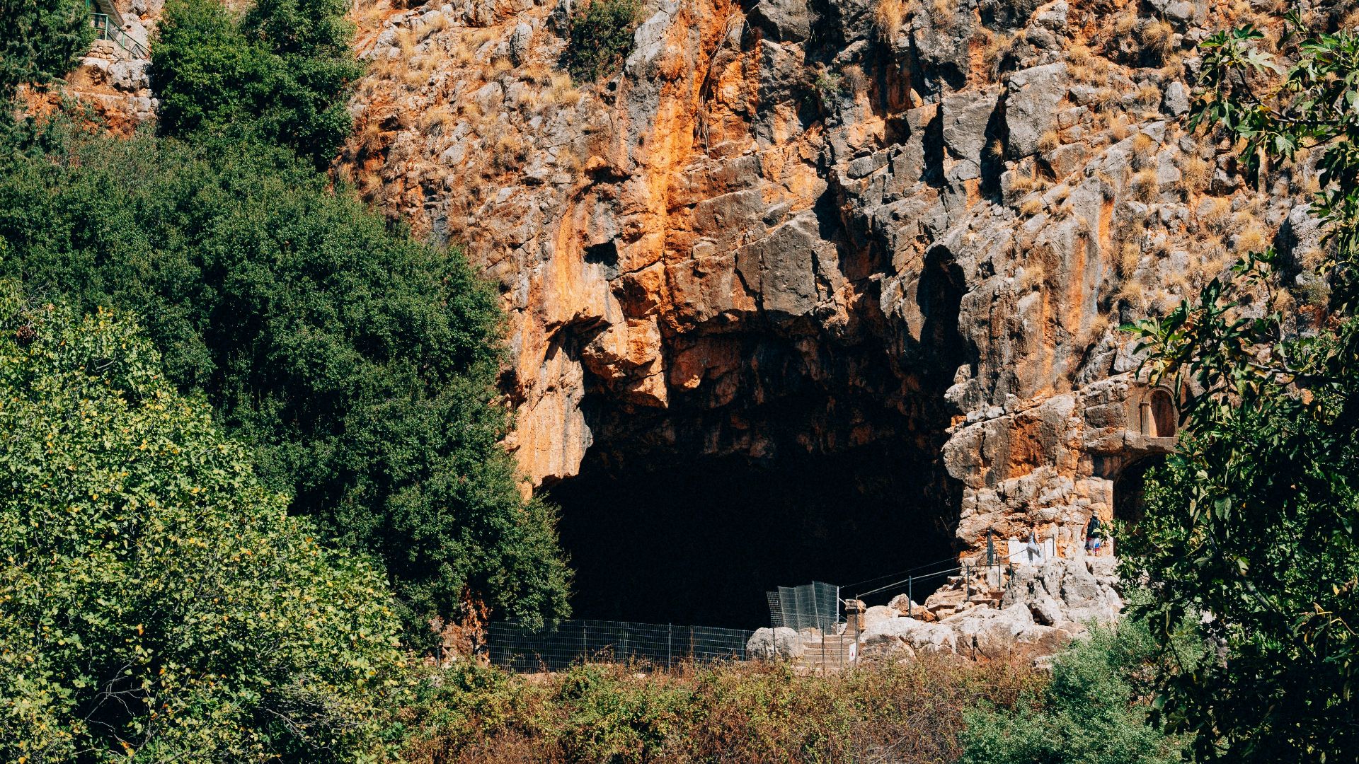 a large rock formation with a cave in the middle of it