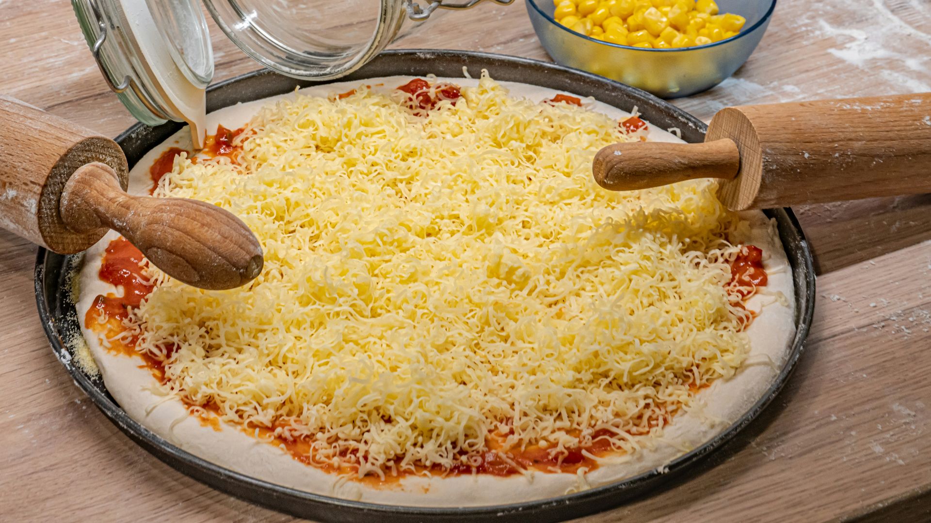 A pizza sitting on top of a pan covered in cheese