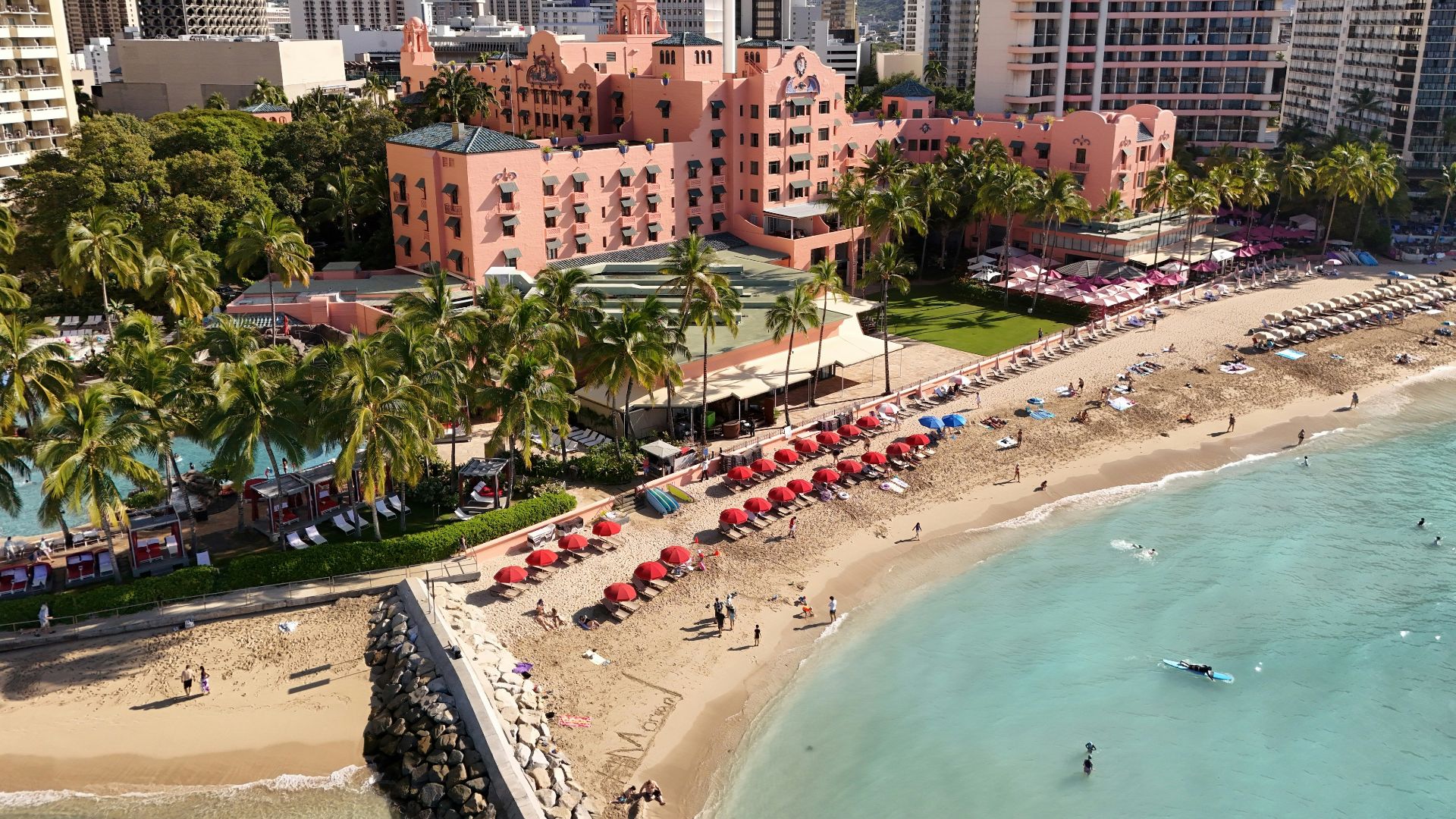 Beautiful beach scene with a resort and city skyline