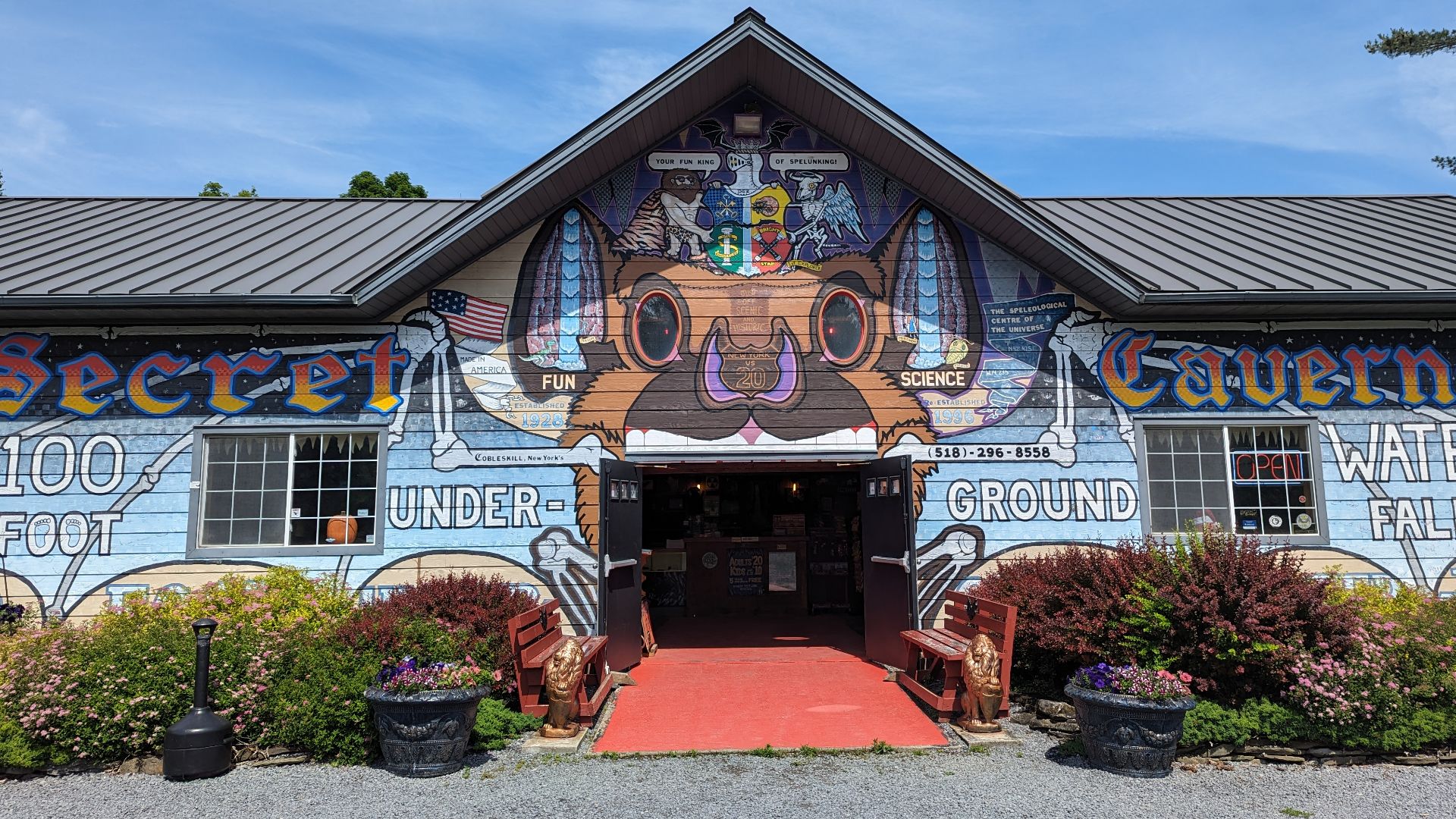 This is the Secret Caverns lodge in New York, where one can buy tickets to tour the caverns and features folk art both outside and inside the building.