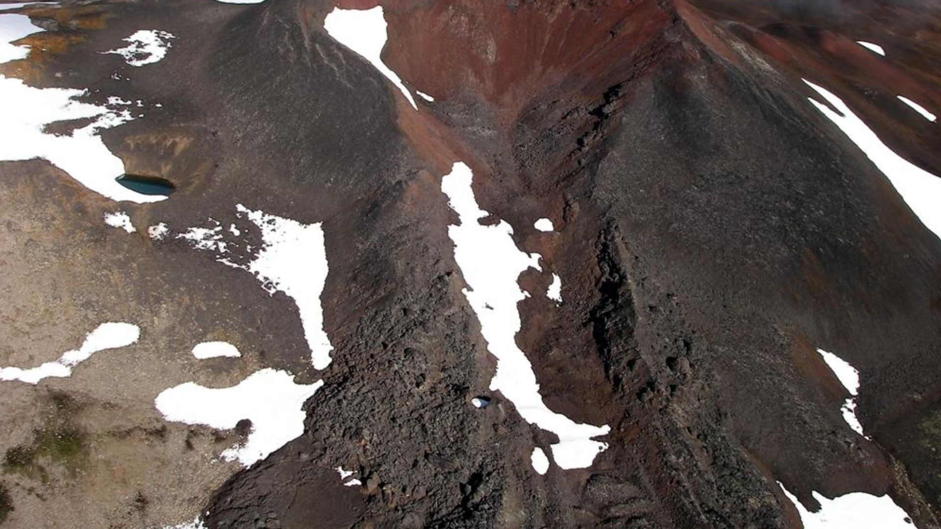 Nahta Cone as seen from the east. It is one of several volcanic cones in Mount Edziza Provincial Park of northern British Columbia, Canada, and was the source of a 5 kilometre long lava flow that travelled north into a valley southwest of Tadekho Hill.