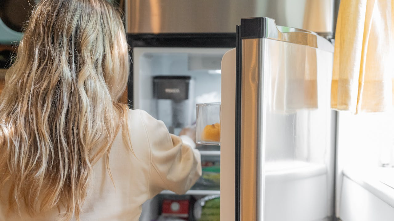 Woman Getting Some Foods in the Refrigerator