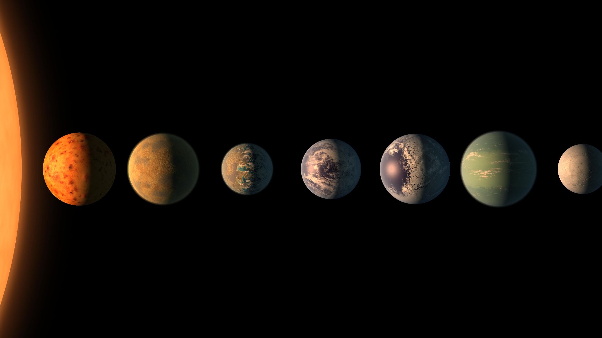 This artist's concept shows what the TRAPPIST-1 planetary system may look like, based on available data about the planets' diameters, masses and distances from the host star. The system has been revealed through observations from NASA's Spitzer Space Tele