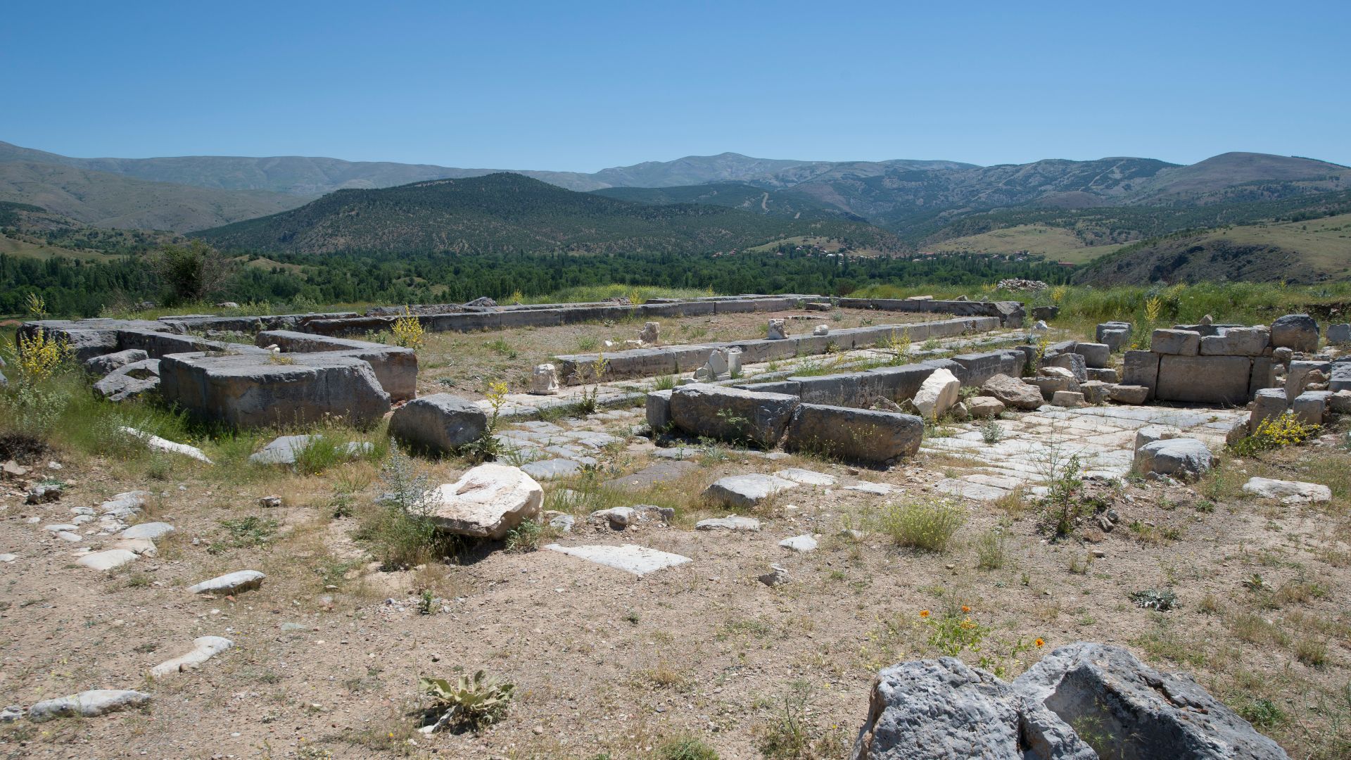 Nymphaeum (Fountain): The building is a wide U-shape. It was built to collect water brought by aqueduct and distribute it throughout the city. The building included a reservoir measuring 27 x 3 m, an ornamented 9 m high façade, and a pool of 27 x 7 m and 