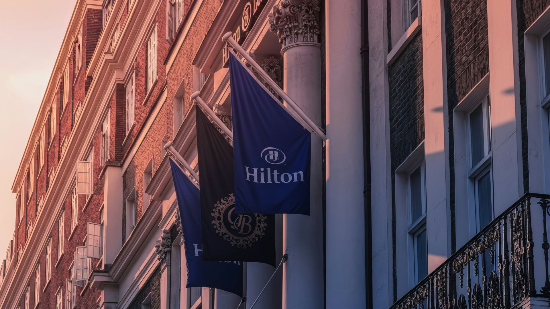 Hilton hotel flags on building exterior