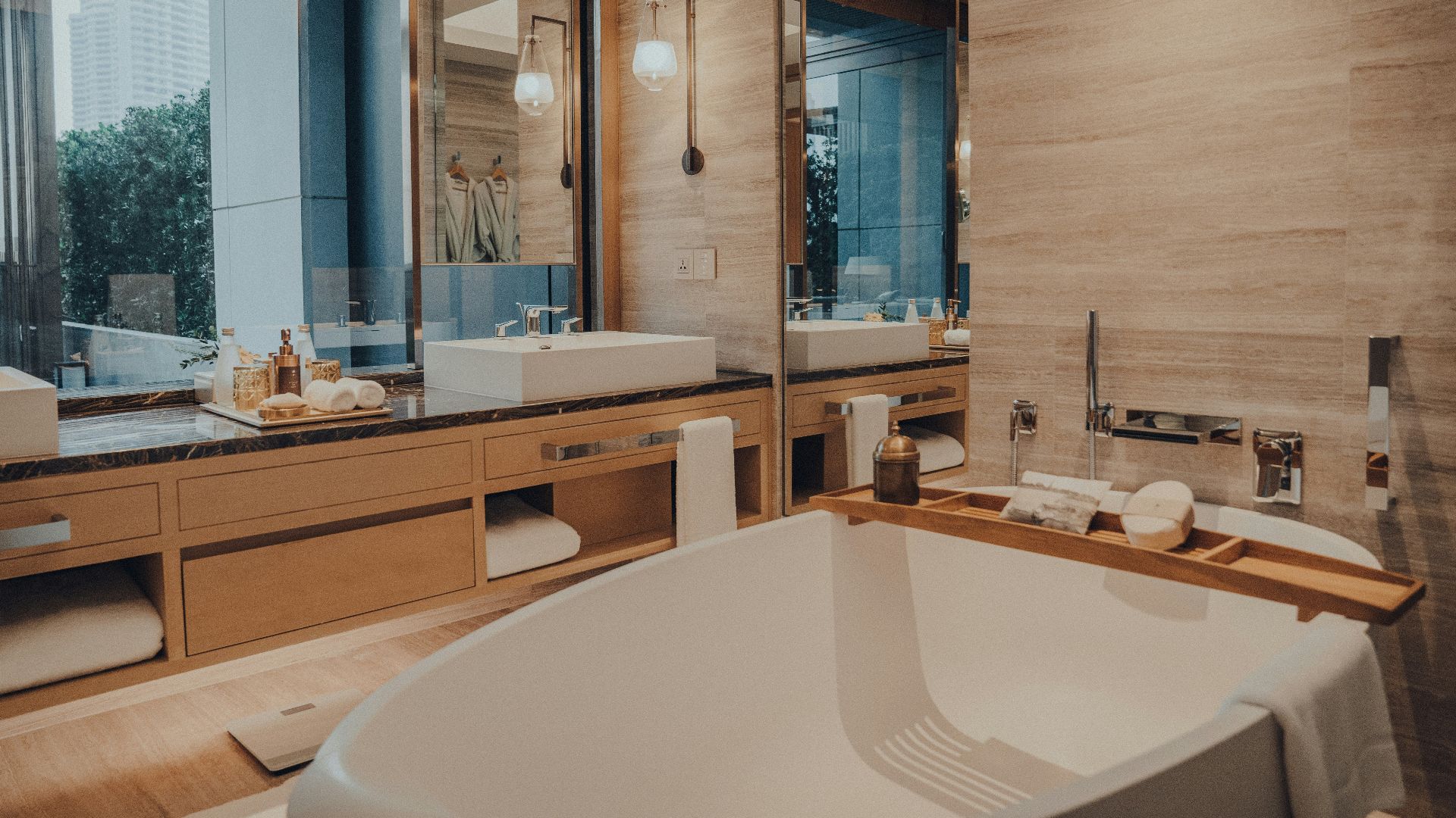 a bathroom with a large bathtub next to a window