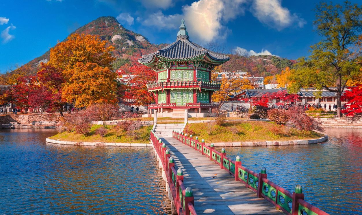 gyeongbokgung palace in autumn, lake with blue sky, Seoul, South Korea.