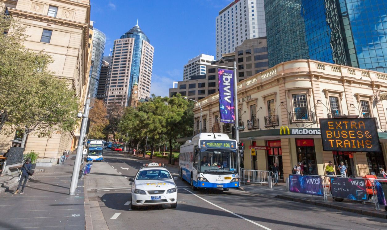 SYDNEY, NSW, AUSTRALIA - May 30, 2014: Buses and taxis in Sydney Circular Quay. Sydney's public transport system features a comprehensive network of train, bus and ferry services.