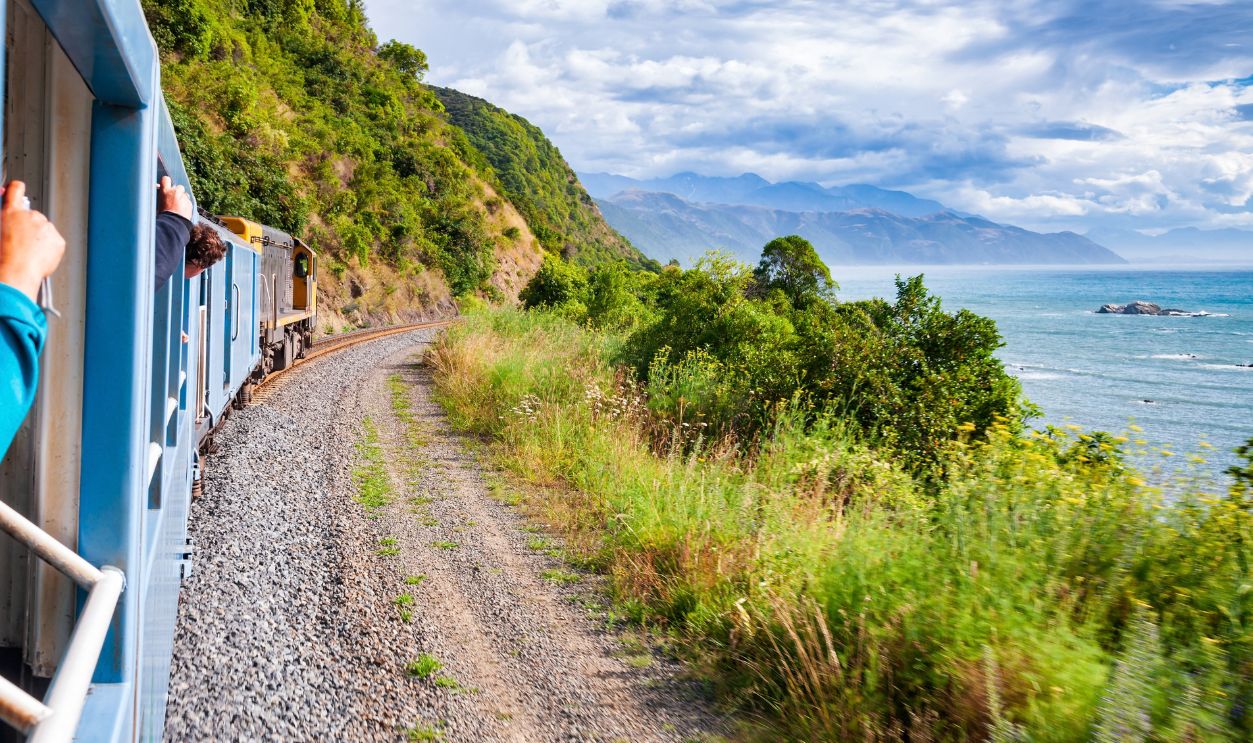 Scenic train ride along Pacific ocean coast in Canterbury regoin, South Island of New Zealand