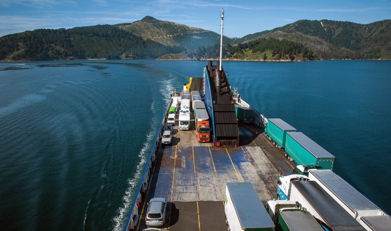 Ferry loaded with trucks and cars traveling from Wellington to Picton via Marlborough Sounds, New Zealand