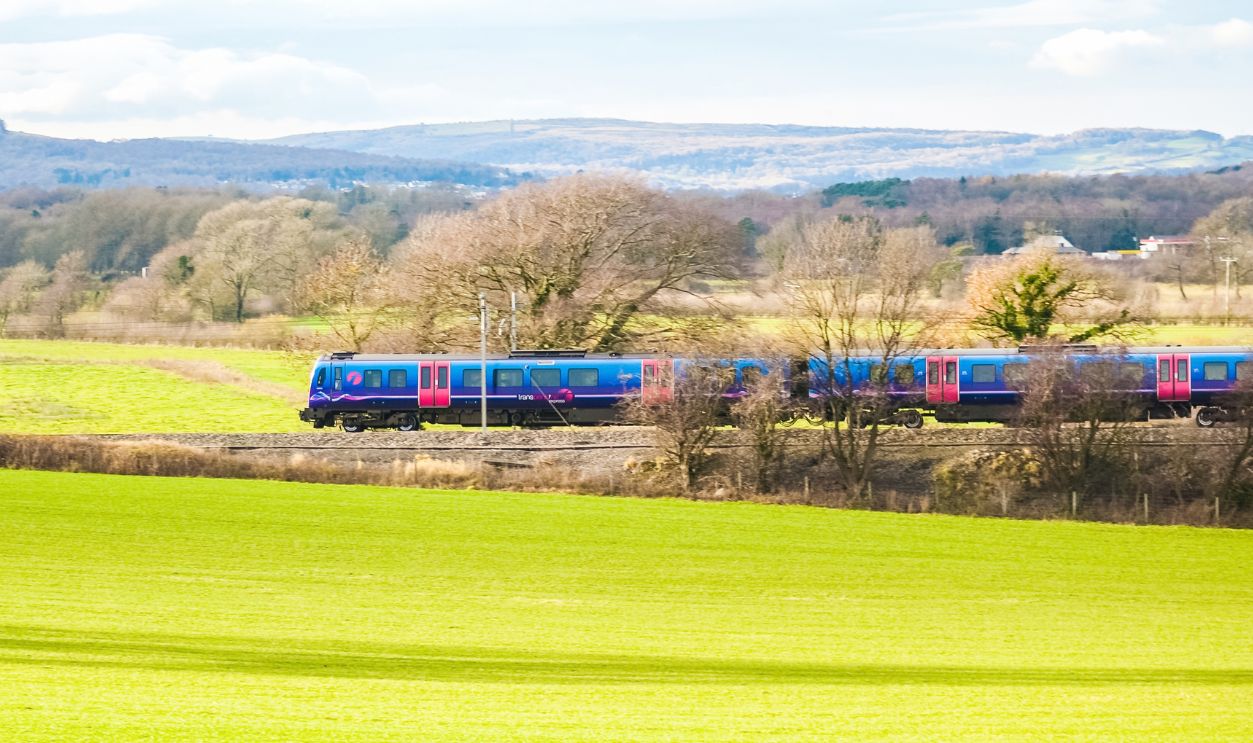 A TransPennine Express passenger train in the countryside UK