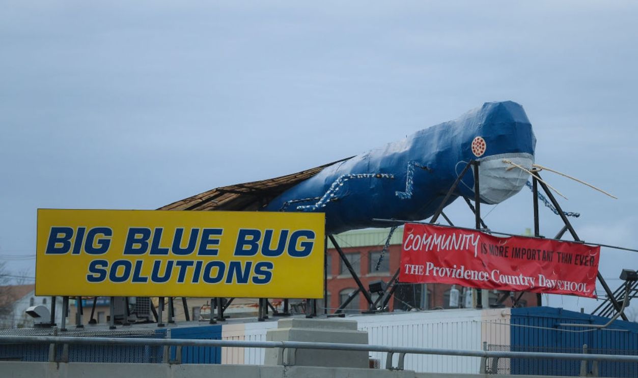 BOSTON, MA - APRIL 29: Big Blue Bug Solutions' rooftop mascot wears a mask at its location in Providence, RI on April 30, 2020.