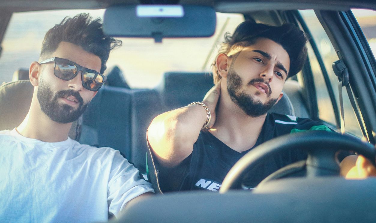 A couple of men driving