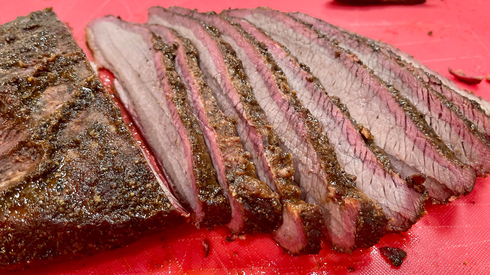 This image shows a perfectly smoked brisket with smoke ring.