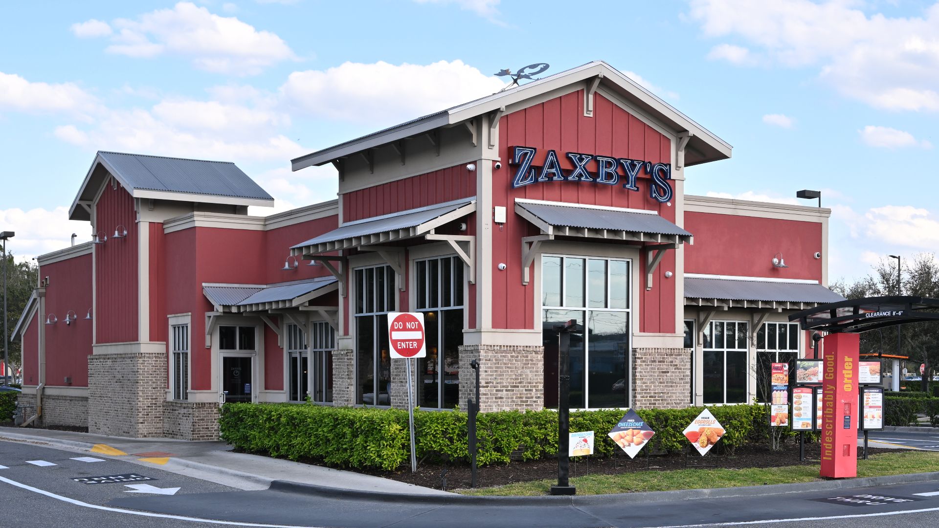 The Zaxby's restaurant at the Vista palms strip mall. 7061 Narcoossee Rd, Orlando, Florida, 32822.