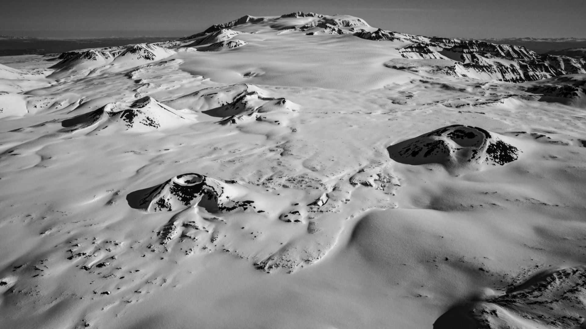 Mount Edziza from the south. Coffee Crater is at left center, Techno Glacier is at center and Ice Peak (the remains of another ancient volcano in the Mount Edziza Volcanic Complex) at upper right center.  Edziza itself is at upper center, the southern rim