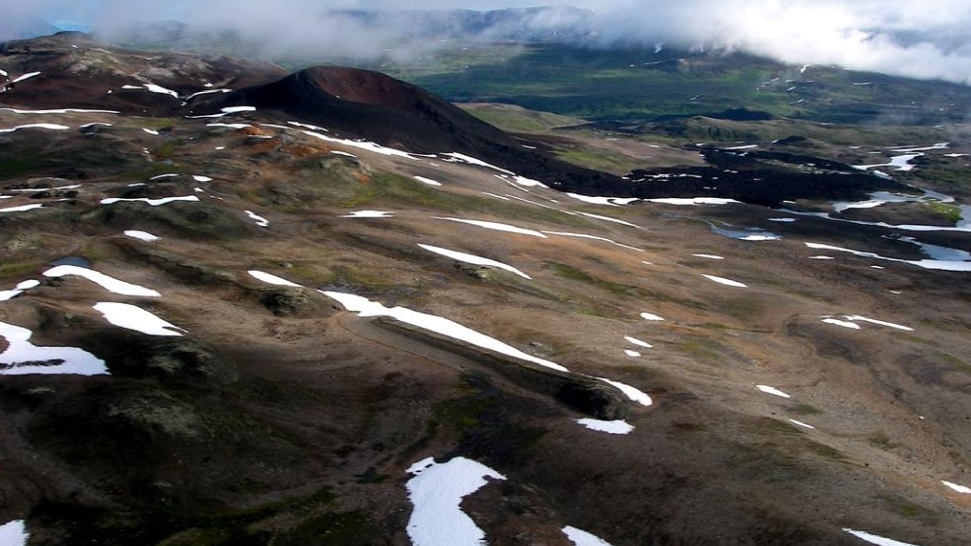 Nahta Cone as seen from the southeast. It is one of several volcanic cones in Mount Edziza Provincial Park of northern British Columbia, Canada, and was the source of a 5 kilometre long lava flow that travelled north into a valley southwest of Tadekho Hil