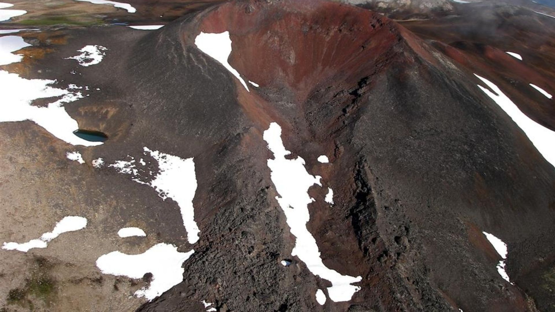 Nahta Cone as seen from the east. It is one of several volcanic cones in Mount Edziza Provincial Park of northern British Columbia, Canada, and was the source of a 5 kilometre long lava flow that travelled north into a valley southwest of Tadekho Hill.