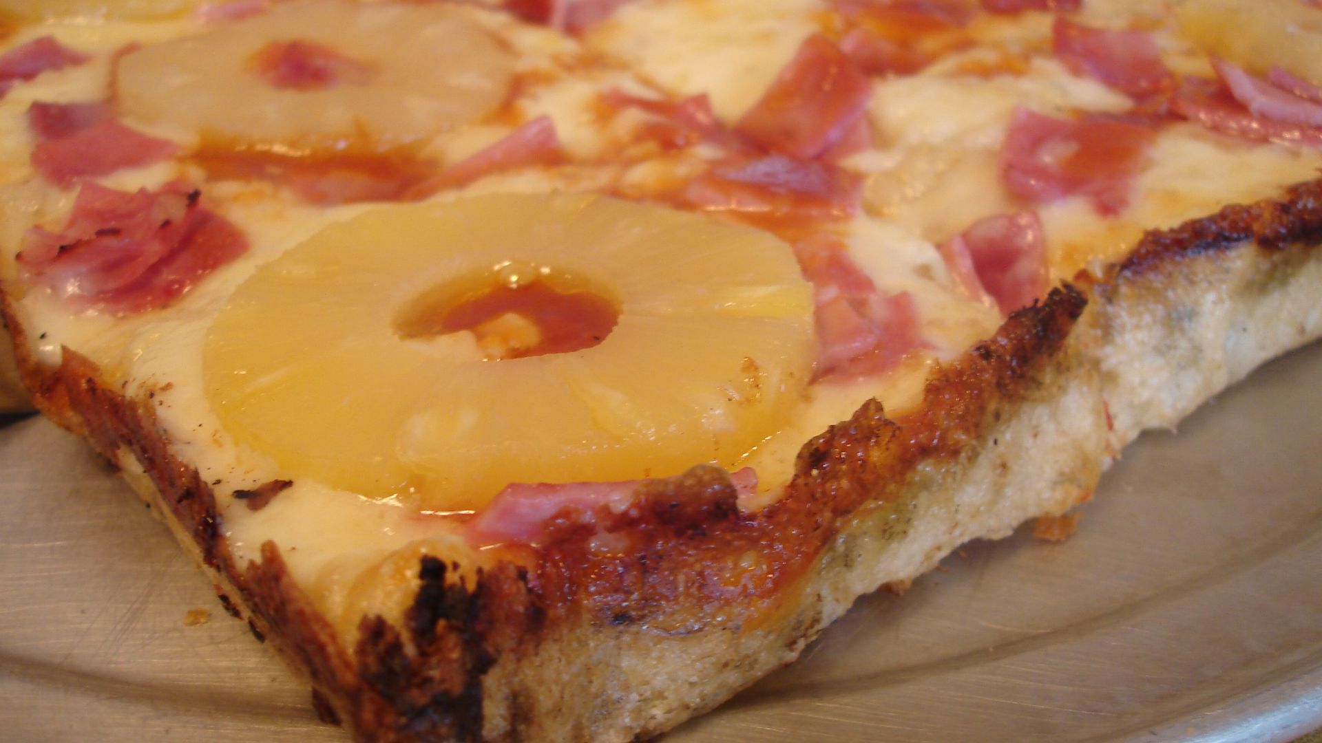 Close-up view of a Hawaiian pan pizza