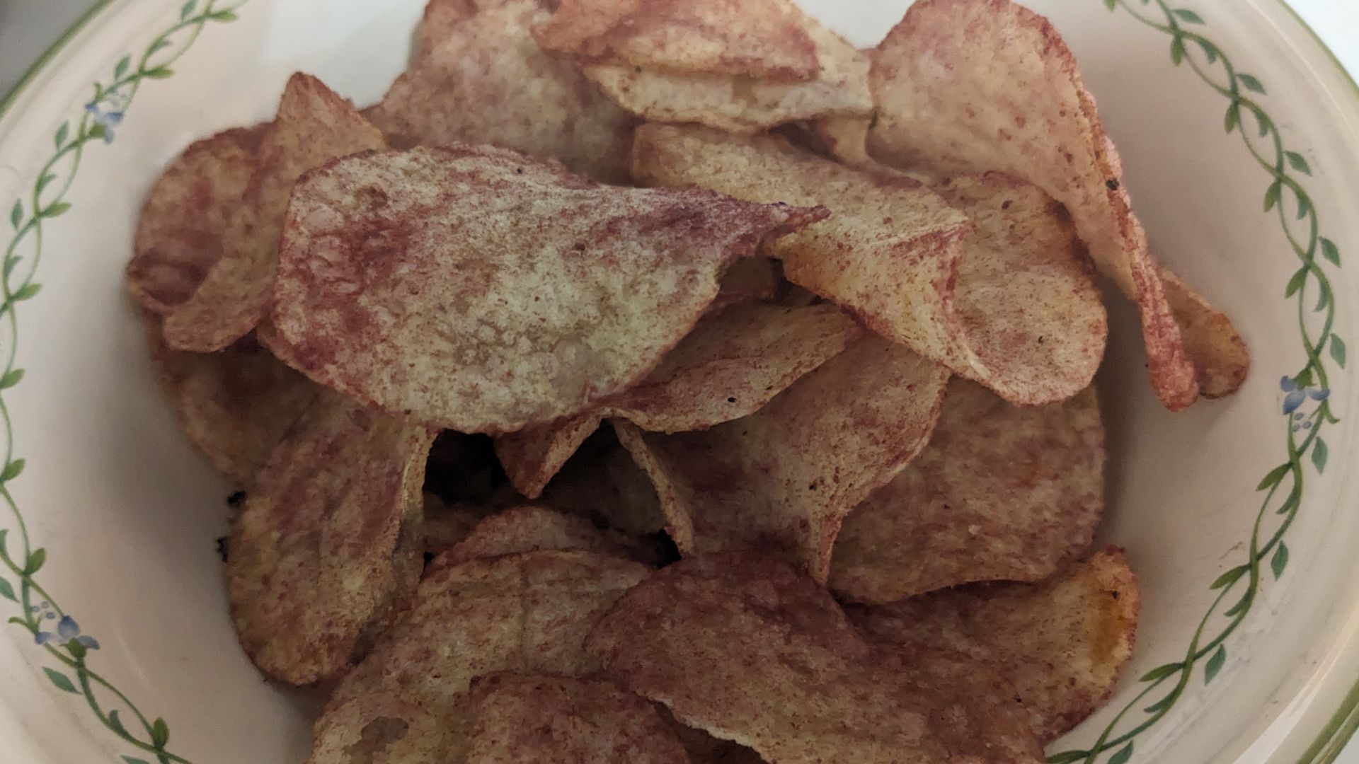 A bowl of ketchup potato chips