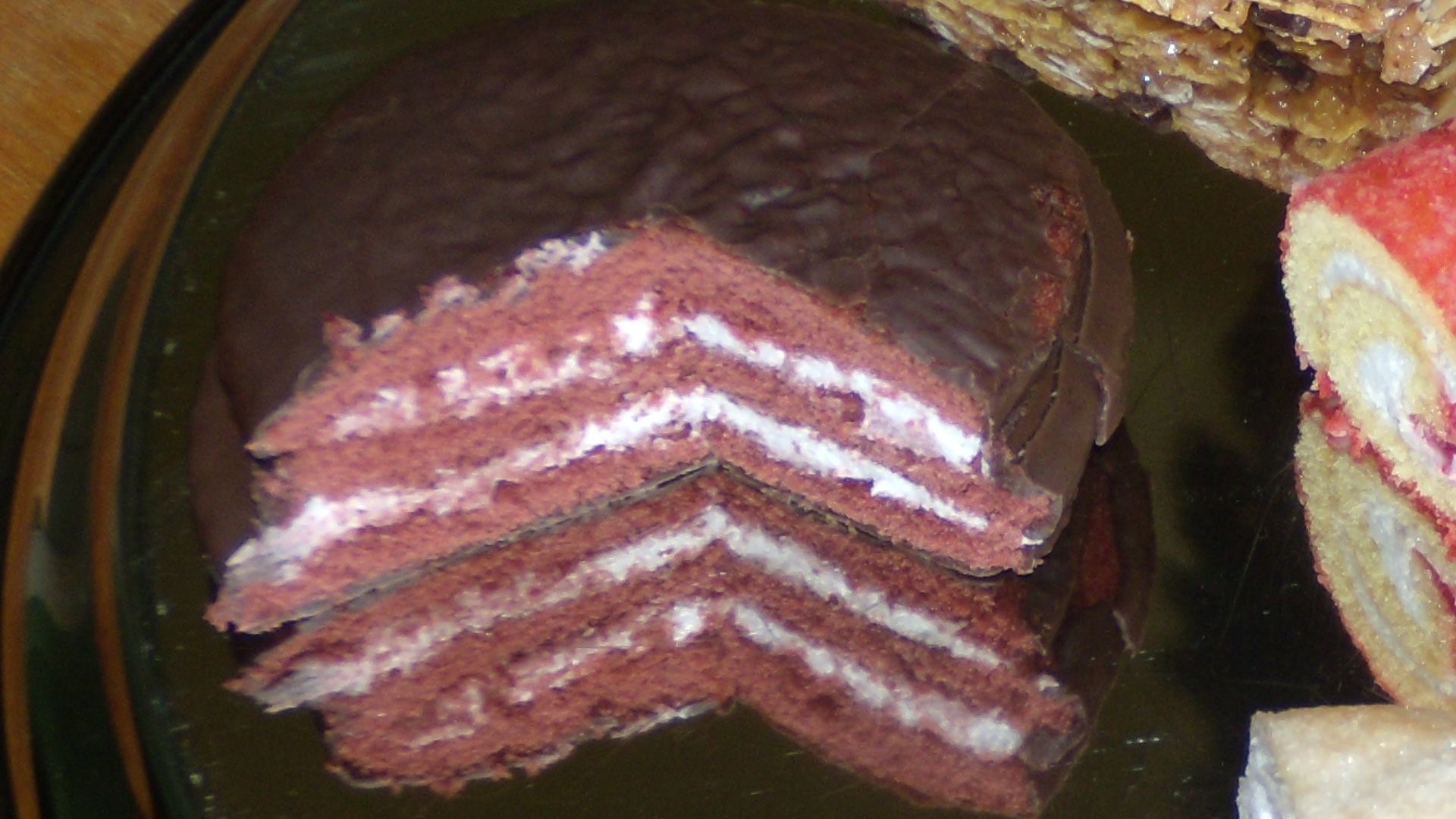 Assortment of Vachon Inc. snack pastries. From top to bottom, left to right : Hop & Go original, Crispy Snack Vanilla, Super Jos. Louis, Jelly Log, Brownies with peanuts, and Passion Flaky raspberry.