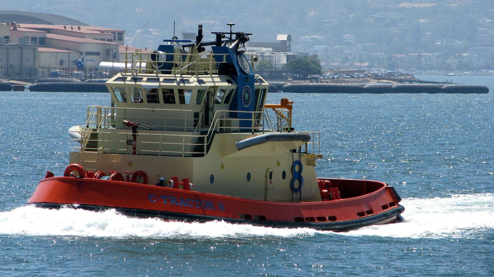 C-Tractor 8 moves up the harbor channel in San Diego.