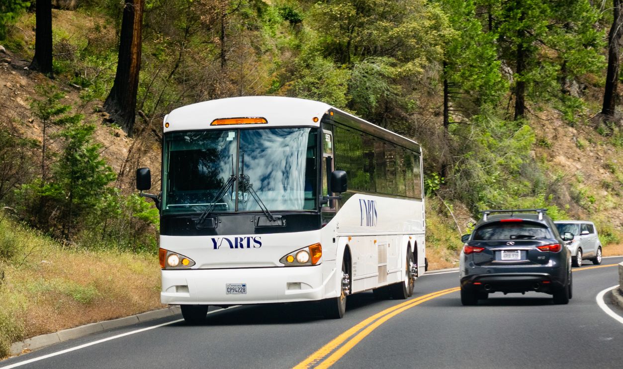 June 28, 2019 Yosemite National Park / CA / USA - YARTS (Yosemite Area Regional Transportation System) bus travelling through Yosemite; YARTS provides service around the park and neighboring areas