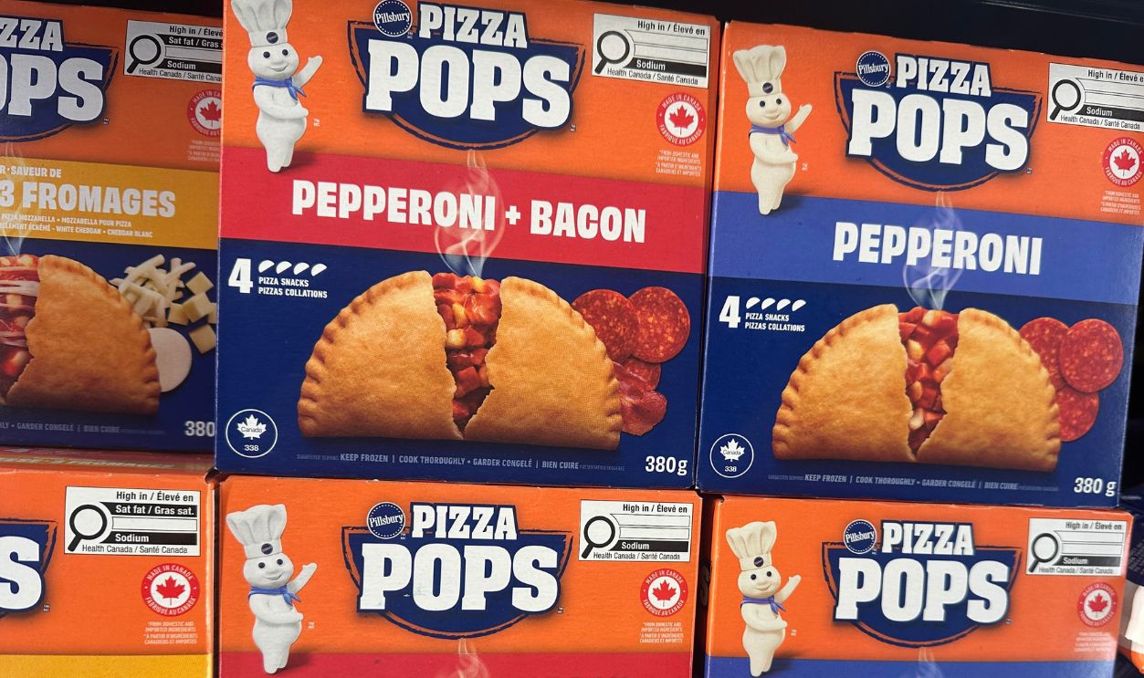 Shutterstock - 2761417441 - Pizza Pops frozen snack products displayed in retail freezer section with pricing and promotional tags in Siksika Nation, Siksika, Alberta, Canada.
