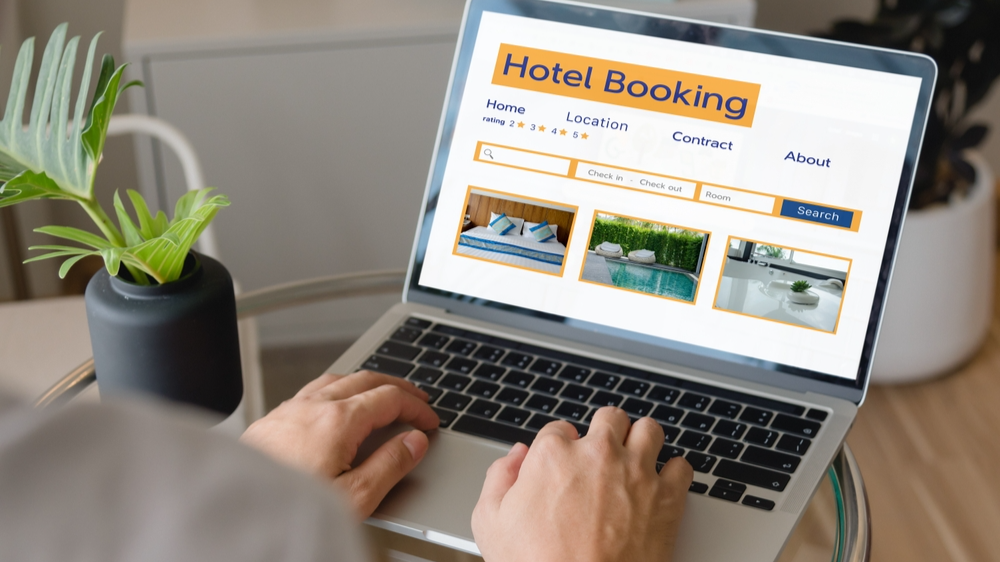 Person using laptop search hotel booking.