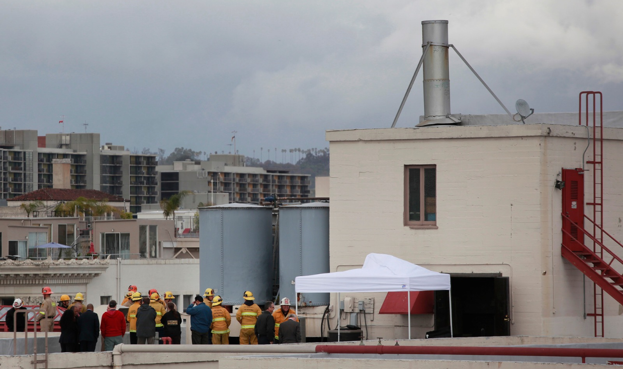  Authorities gathered on the roof of the Cecil Hotel on Main Street, in downtown Los Angeles, follow