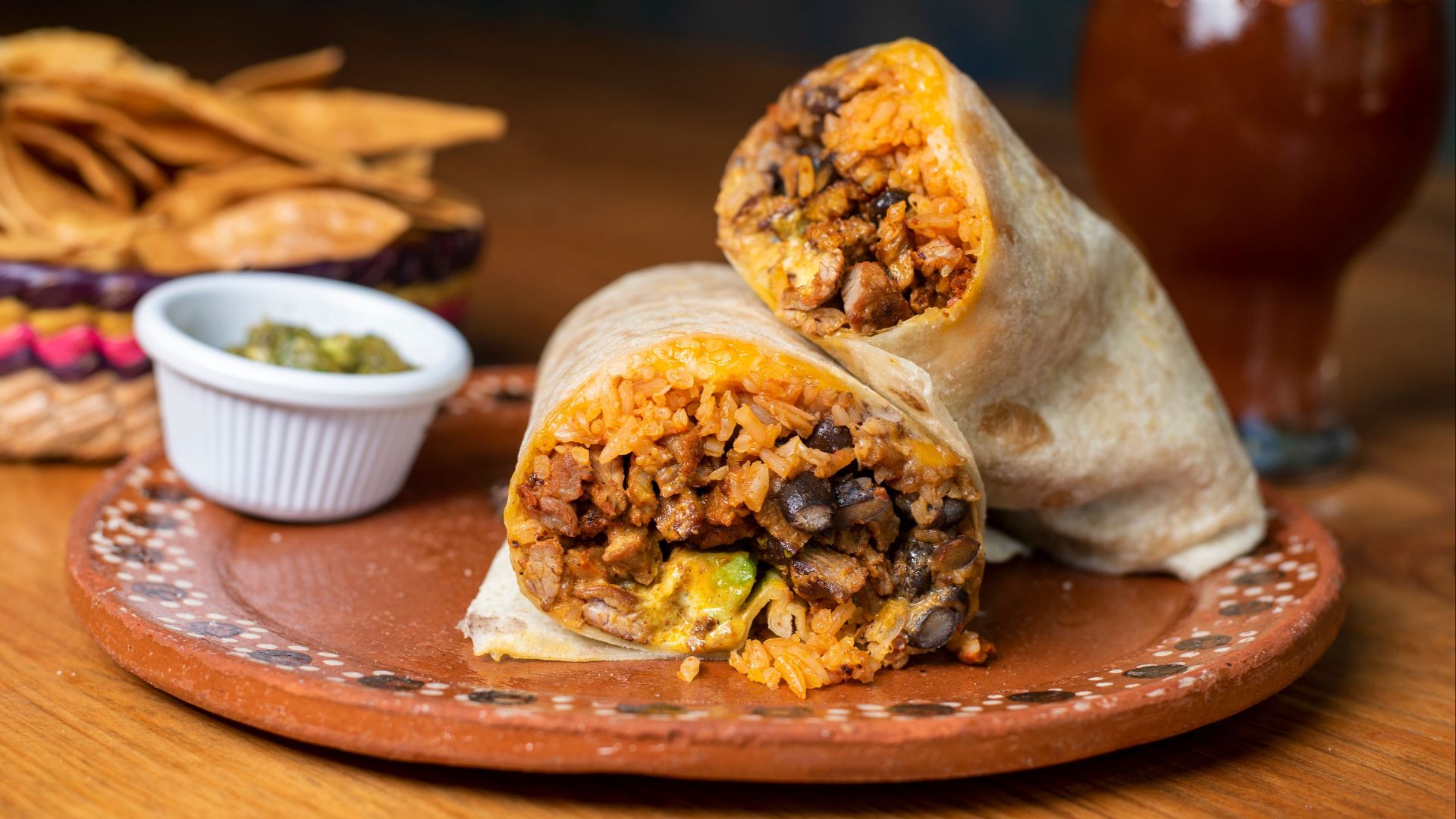 Close-up of a Mexican burrito filled with rice and beans, perfect for food lovers.