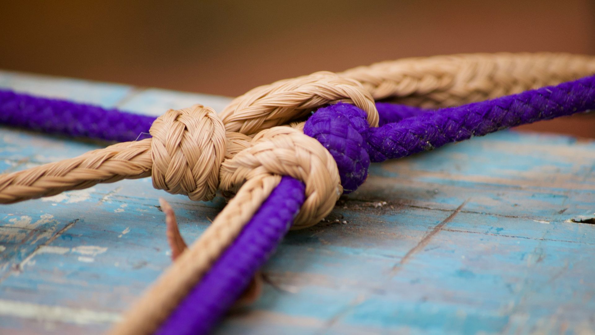 brown rope on blue wooden table