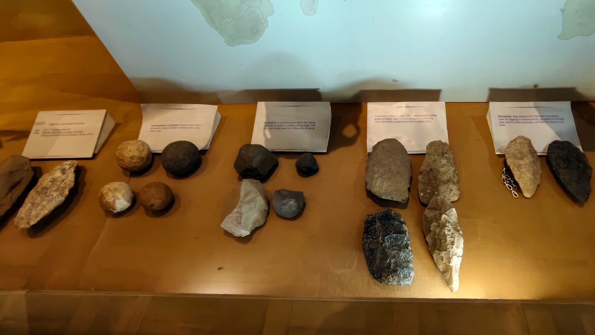 The Oldowan toolkit, the oldest known stone tools dating back at least 2.6 million years, primarily consists of simple hammerstones, stone cores, and sharp flakes used for cutting and chopping.