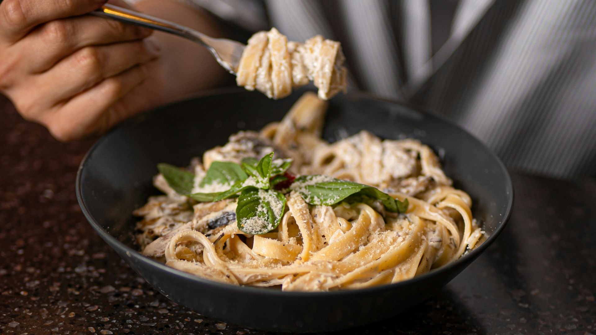 Eating a delicious bowl of creamy pasta