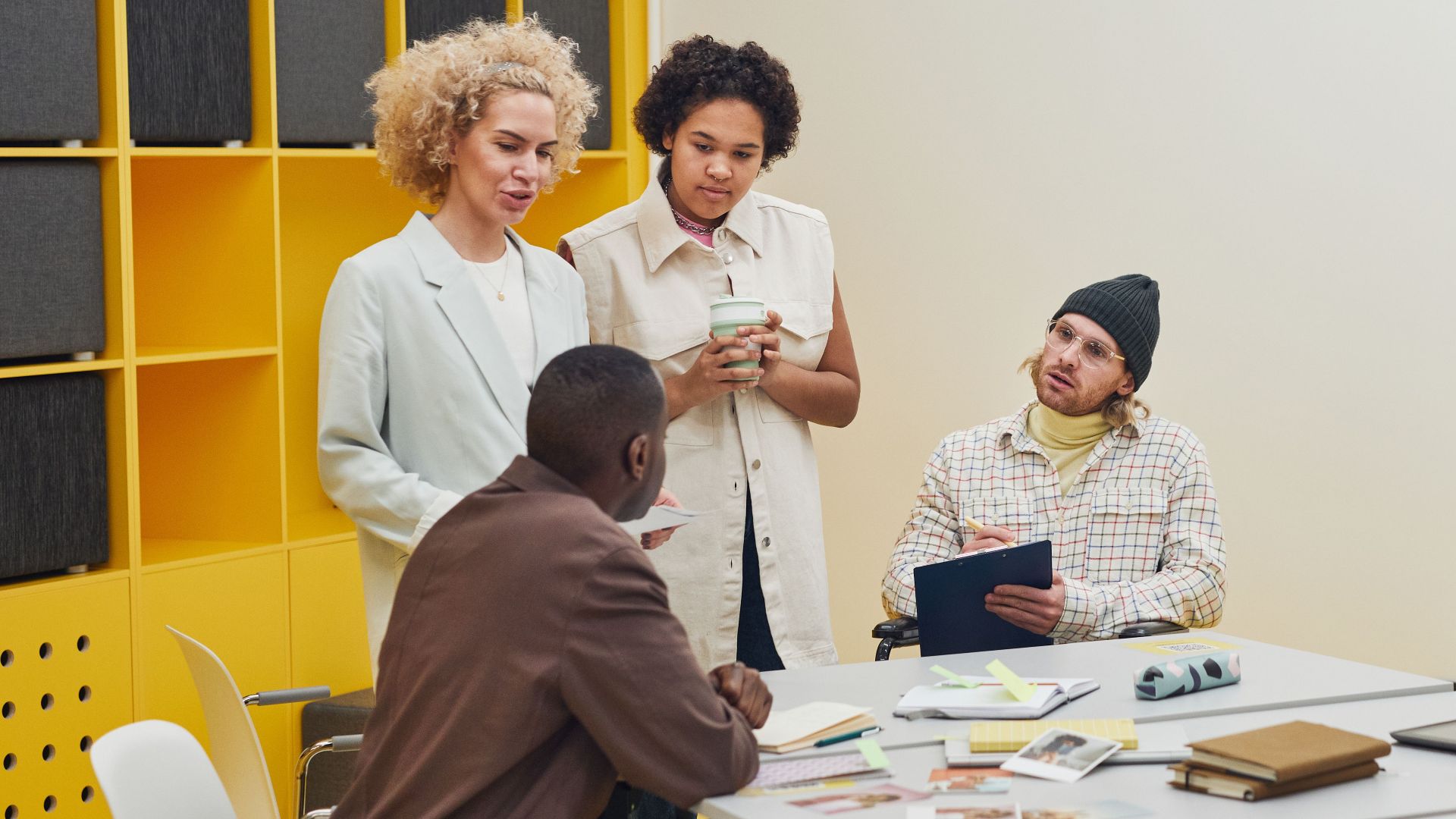 A diverse group of professionals having a collaborative meeting in a modern office space.