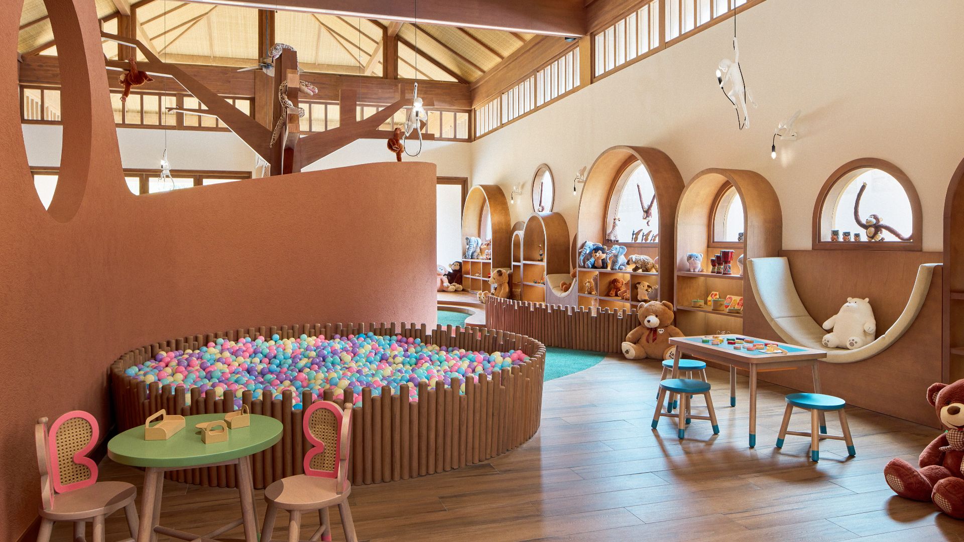 Interior of Kidsdom Kids Club at Paradisus by Meliá Bali, featuring colourful tables, toys, seating and indoor & outdoor activity areas designed for children