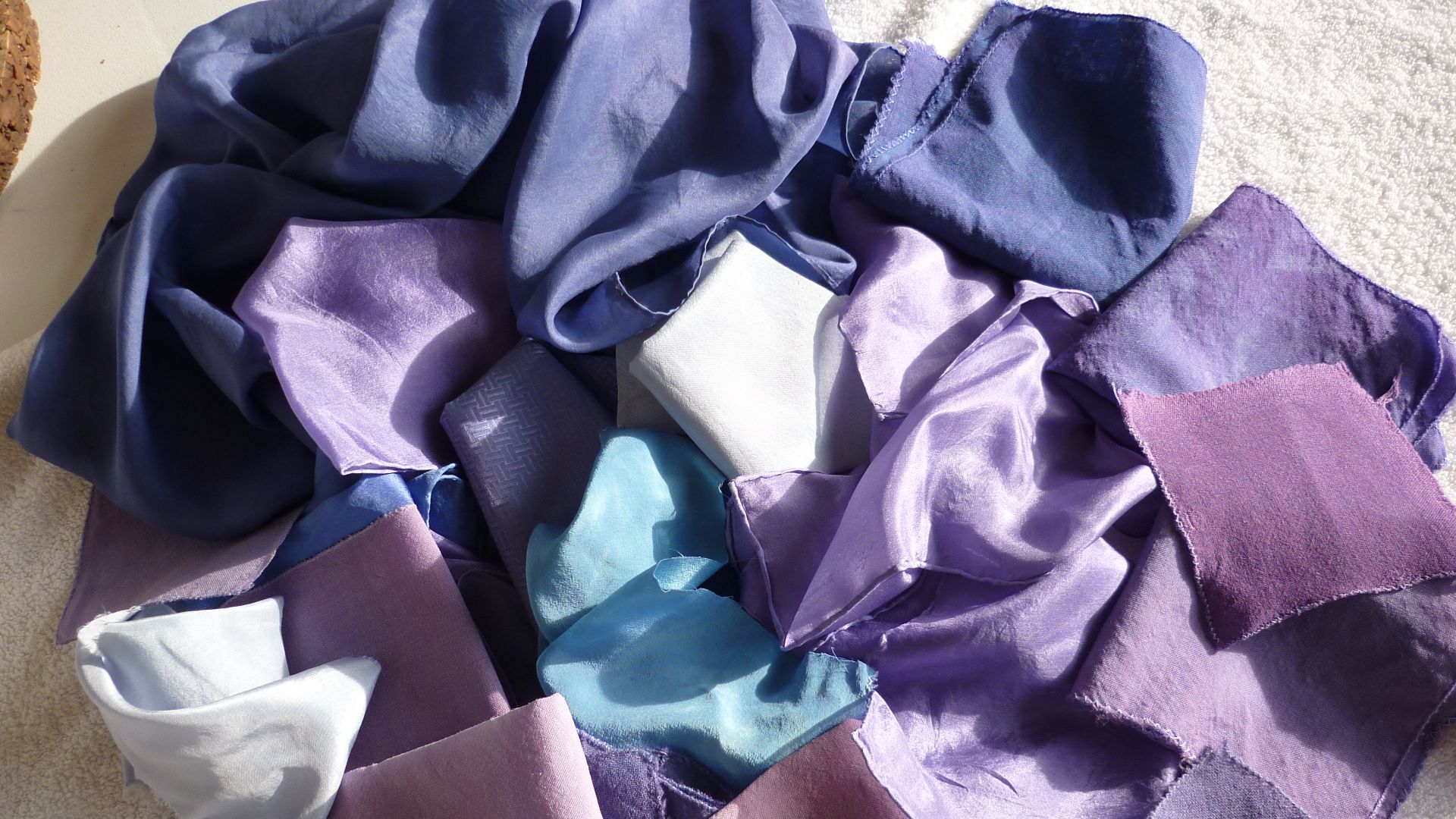 Purple dyeing: different shades of real purple on silk, dyed in a purple dye-bath