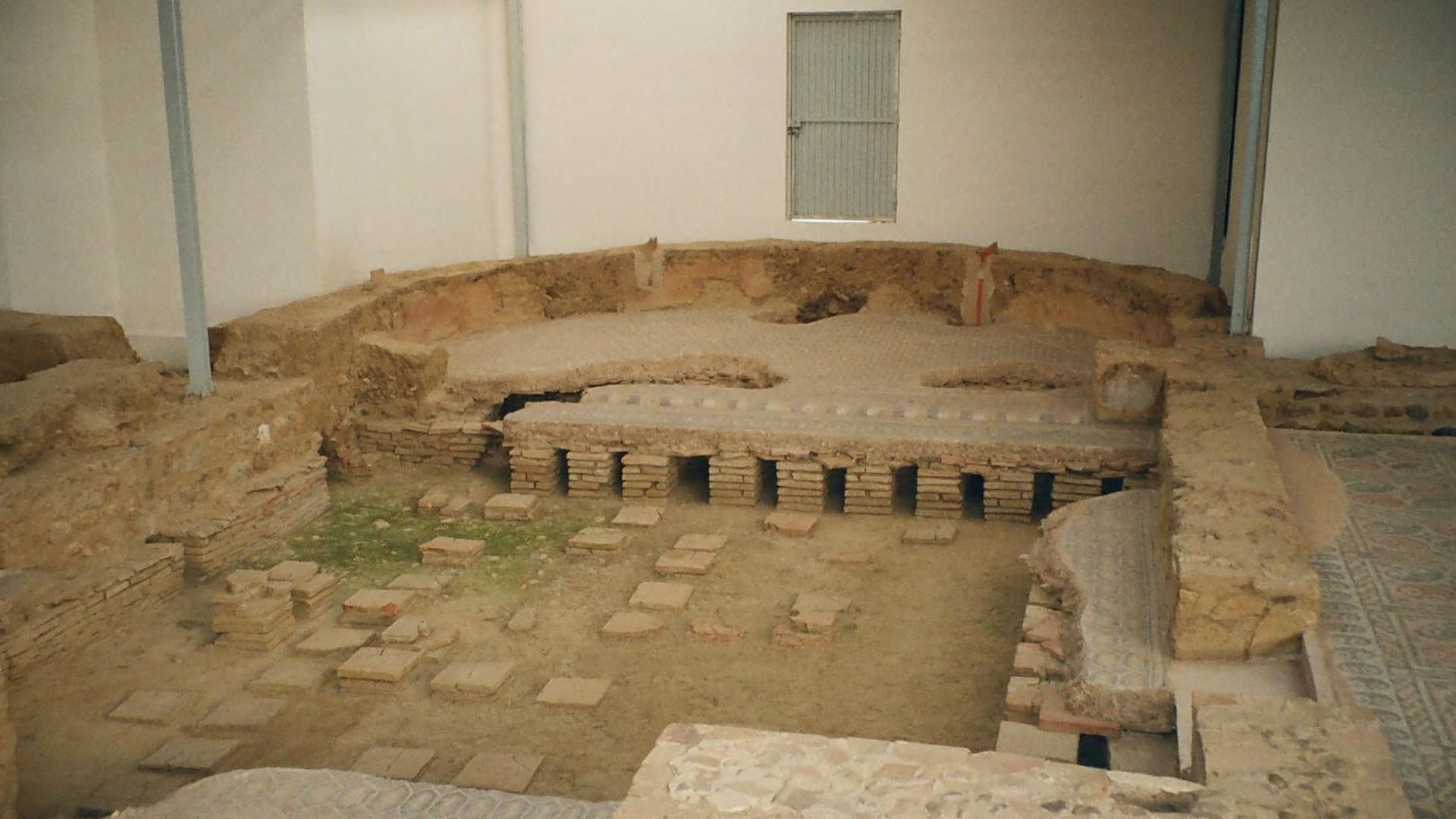 en:Hypocaust from a en:late Roman en:villa. Located at en:La Olmeda, near en:Gañinas and en:Saldaña in Palencia The important mosaics are barely visible in the en:exedra and the other rooms. Copyrighted by en:User:Error 2004.