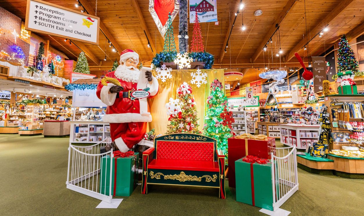 Frankenmuth, MI, USA - 04-22-2025: Santa Claus statue and decorative chair for visitor photos inside Bronners Christmas Wonderland in Frankenmuth Michigan.