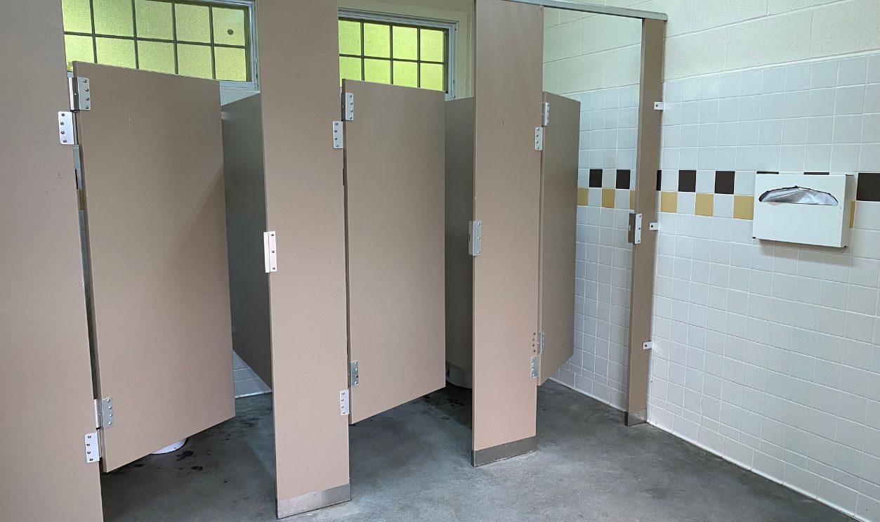 Three Open Public Bathroom Stalls 