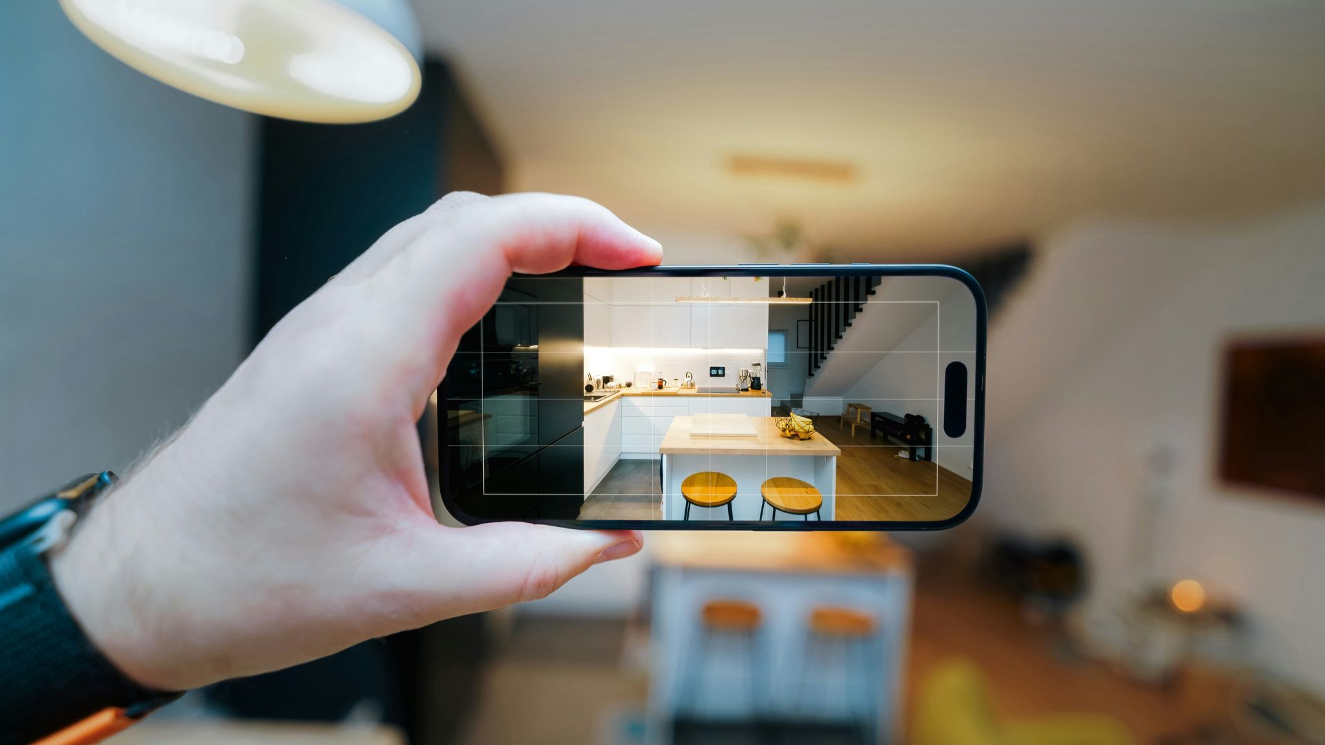 A person taking a picture of a living room