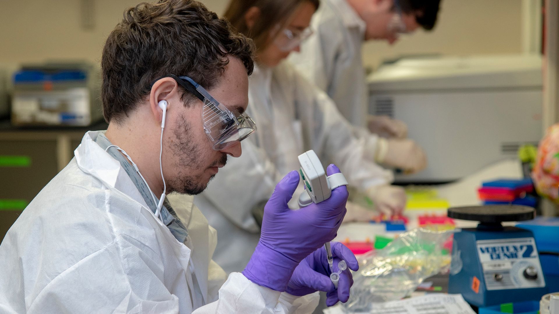 Armed Forces DNA Identification Laboratory analysts place samples into cartridges before loading them into a next-generation DNA sequencing instrument, Aug. 24, 2018. In 2016, AFDIL developed and forensically validated the next-generation mtDNA sequencing