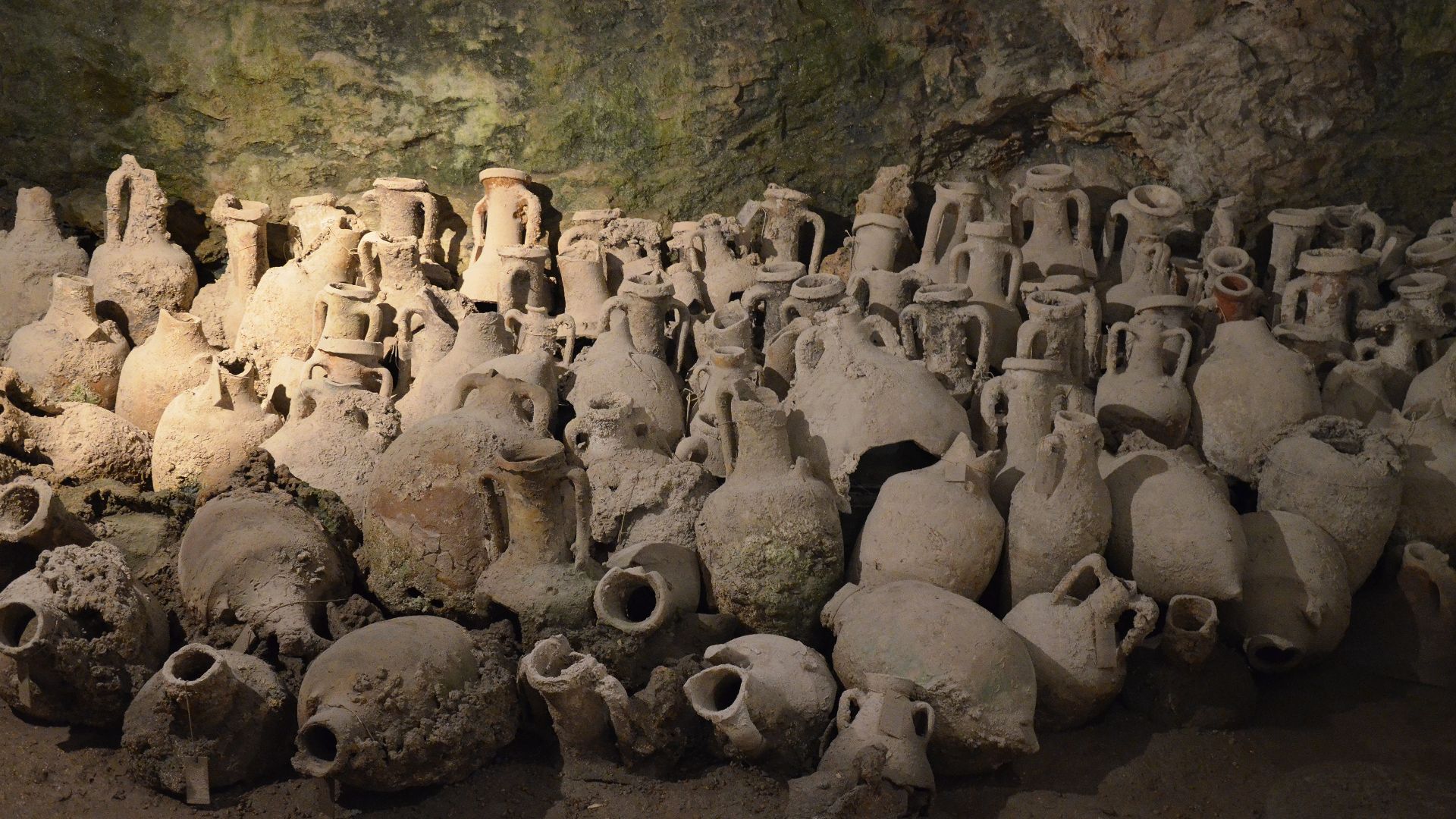 Amphorae are specific vessels that were used for storing and transporting olive oil, wine, salted fish and preserved fruit. They were also used for building as construction and insulating material, as well as for filling in swampy areas. The characteristi