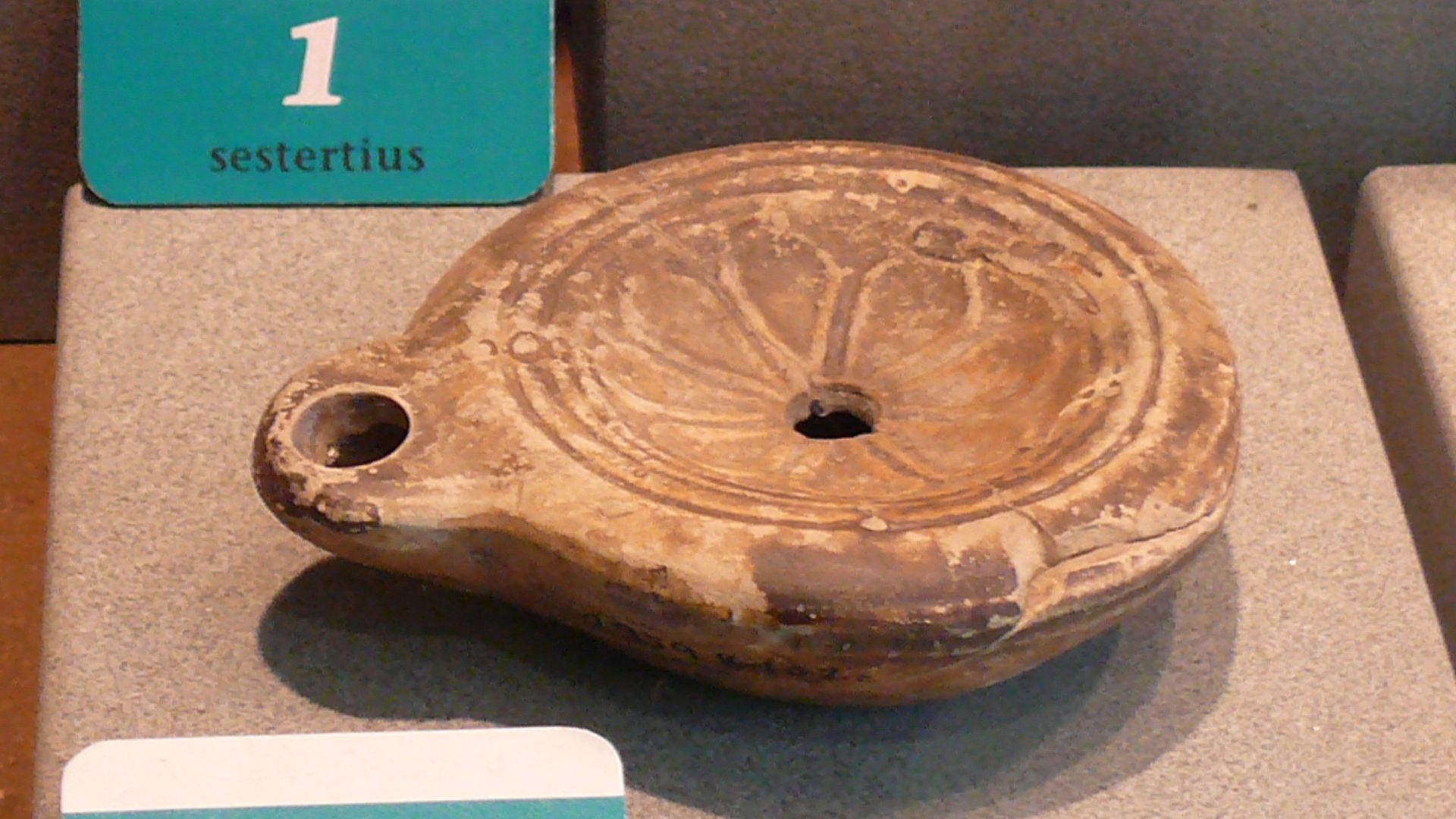 Roman oil lamp. 
From the collection of the  Roman Museum at Augusta Raurica (Augst, Switzerland)