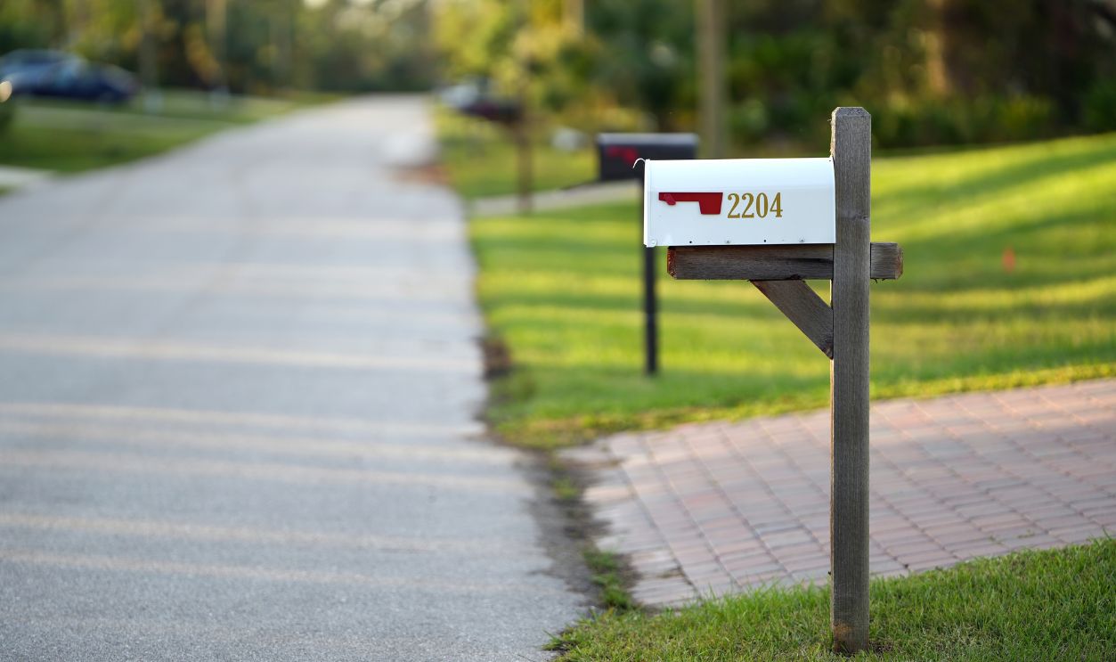Typical american outdoors mail box on suburban street side