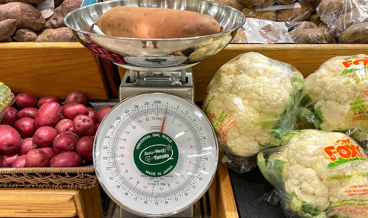 Orlando,FL/USA -1/15/20:  The fresh produce aisle Universal Dial Scale where customers can get a estimate of how much a produce item will weigh and cost.